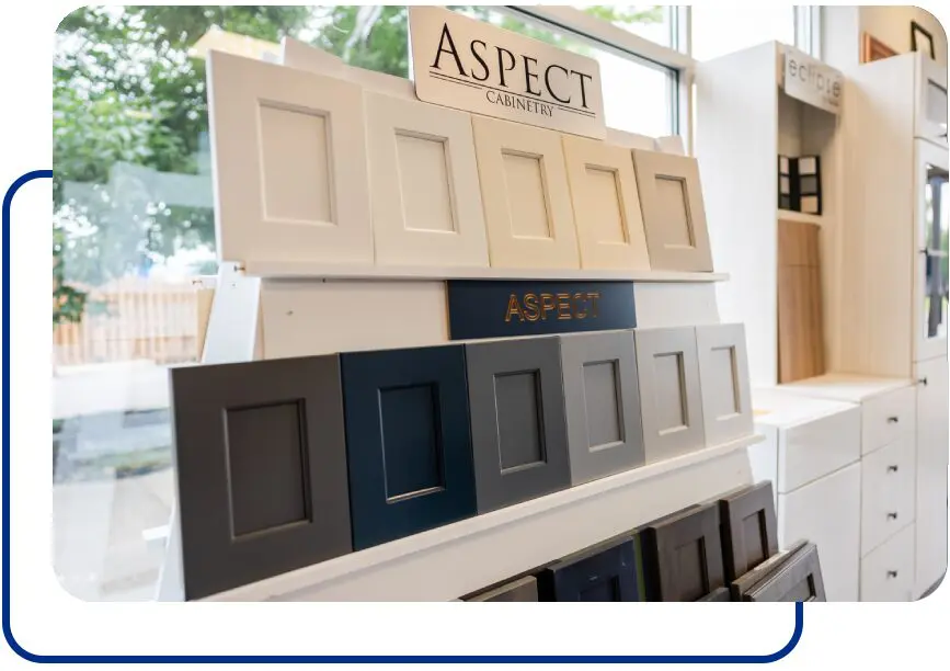 A display of different types of cabinets in front of a window.