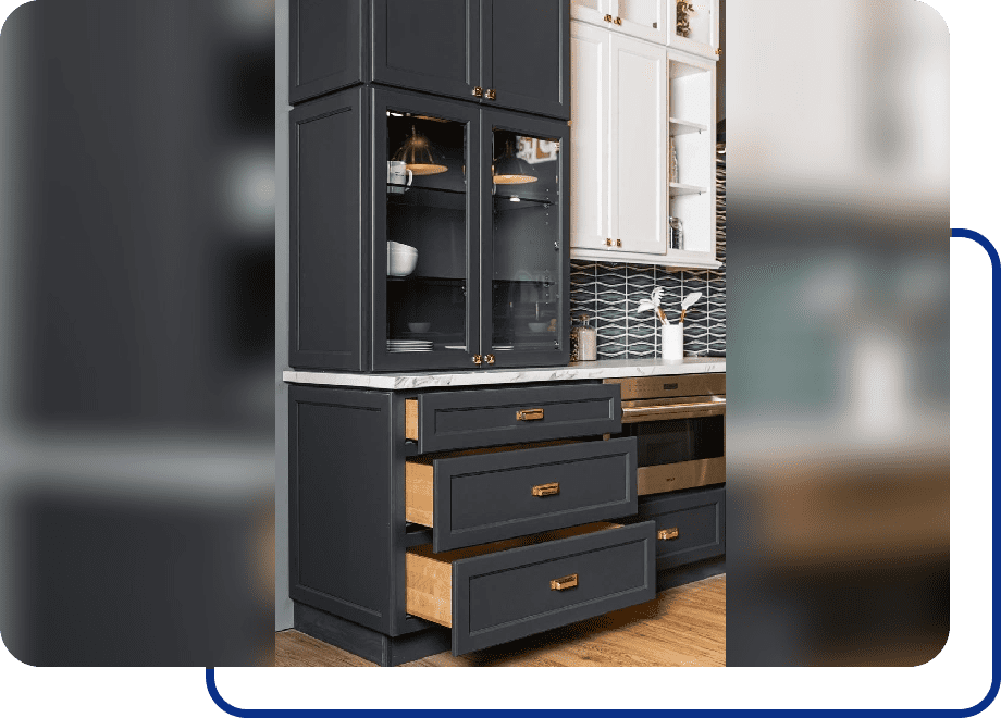 Dark kitchen cabinets with open drawers.