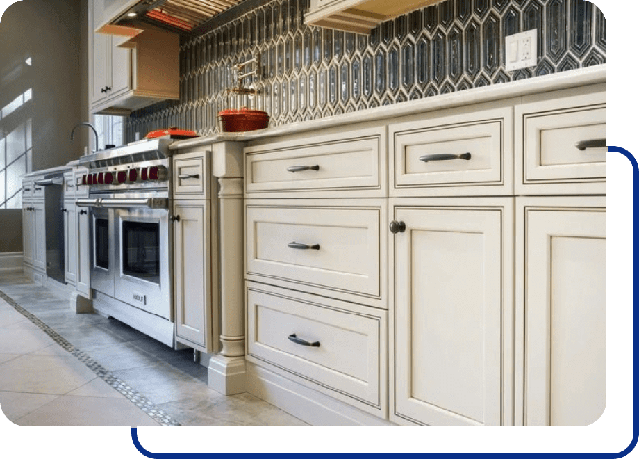 Modern kitchen with white cabinets and stove.