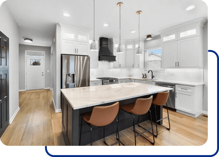 Modern kitchen with island and bar stools.