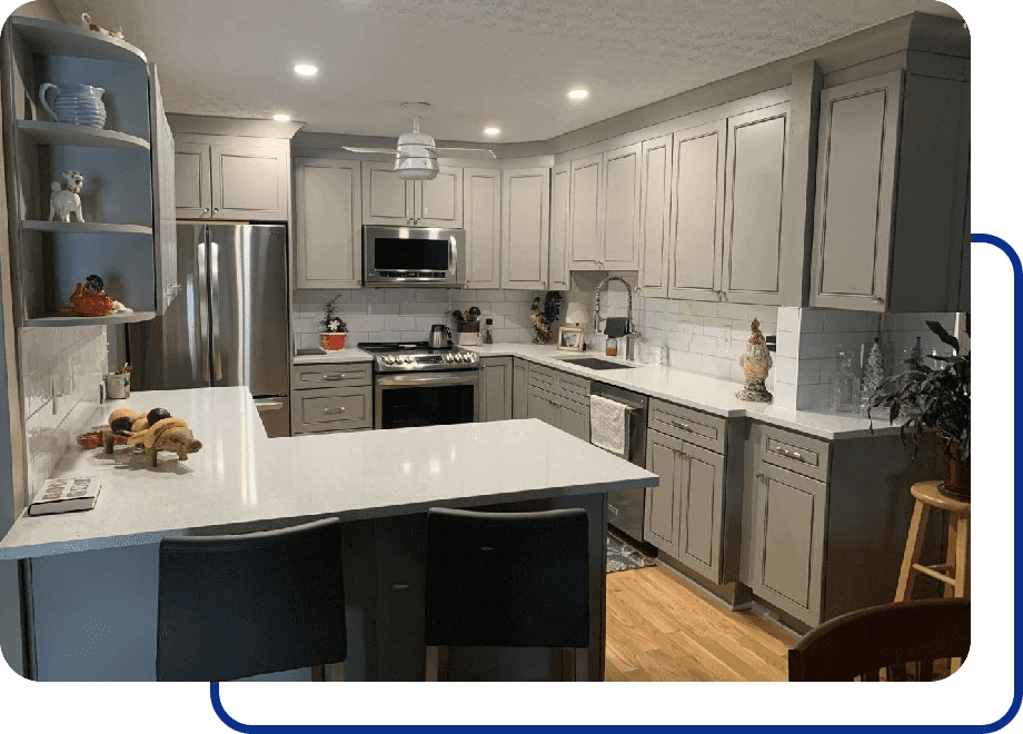 Modern kitchen with gray cabinets and island.