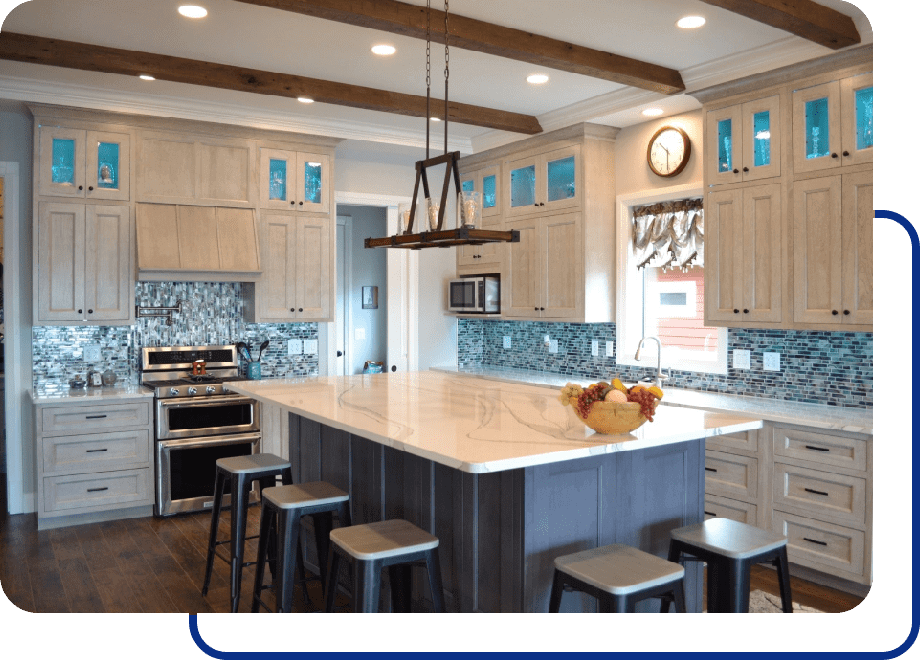 Modern kitchen with island and bar stools.