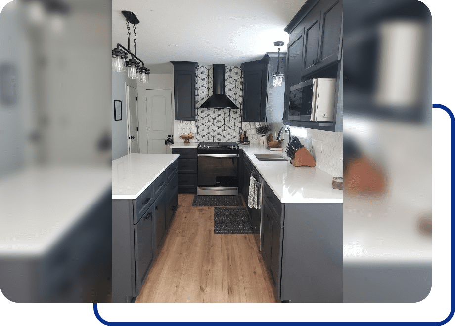 Modern kitchen with dark cabinets and island.