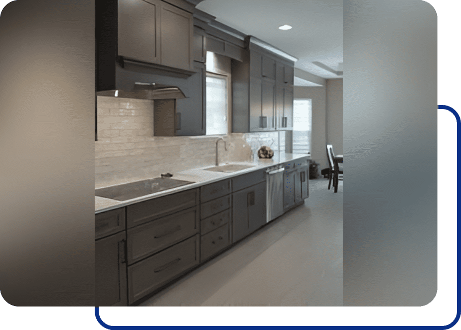 Modern kitchen with dark cabinets and appliances.