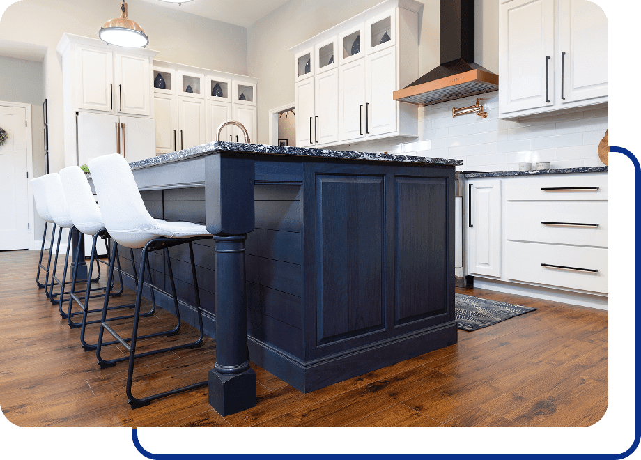 Modern kitchen with island and stools.