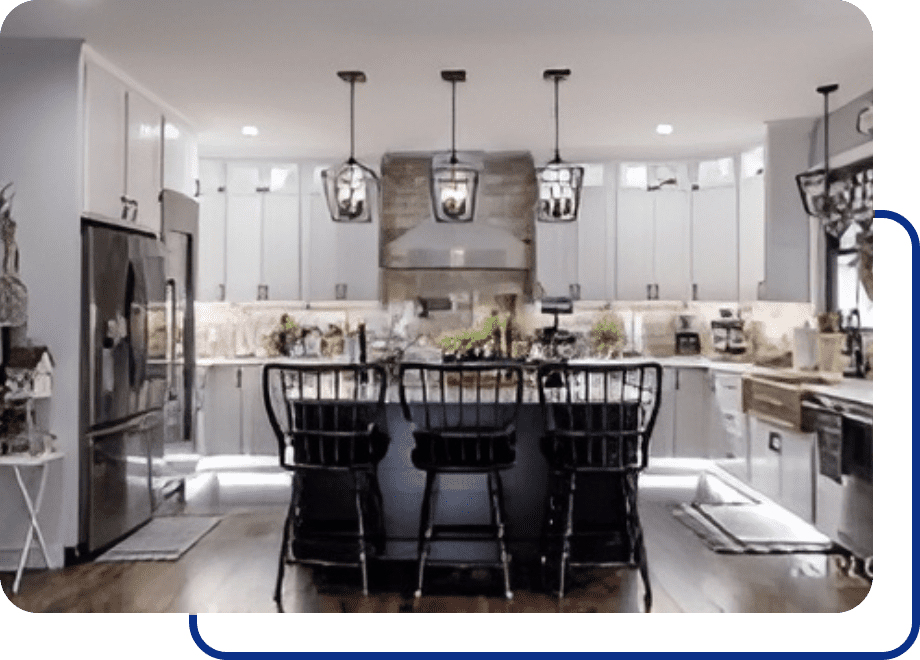 Modern kitchen with island and pendant lights.