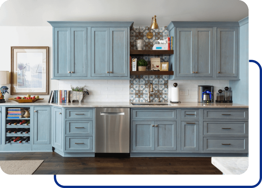 Modern kitchen with blue cabinets and appliances.