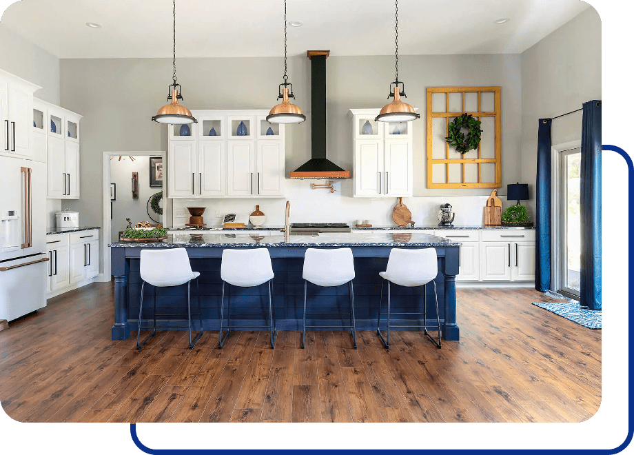 Modern kitchen with island and bar stools.