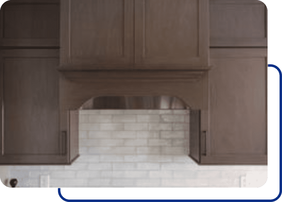 Wooden kitchen cabinets above tiled backsplash.