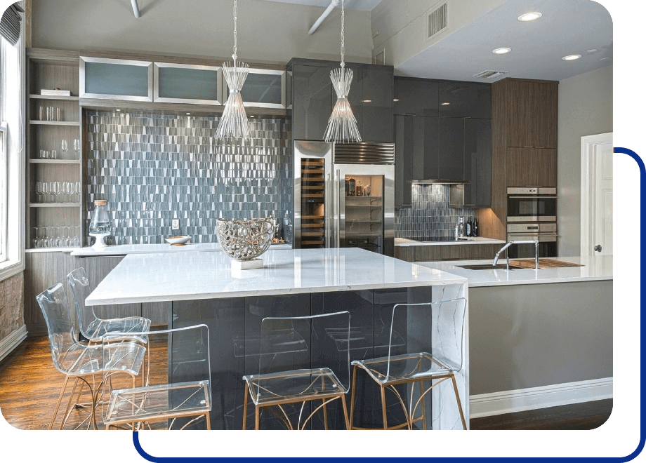 Modern kitchen with marble island and backsplash.